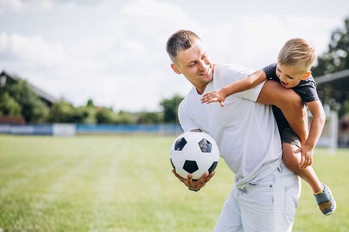 Parent and child with football